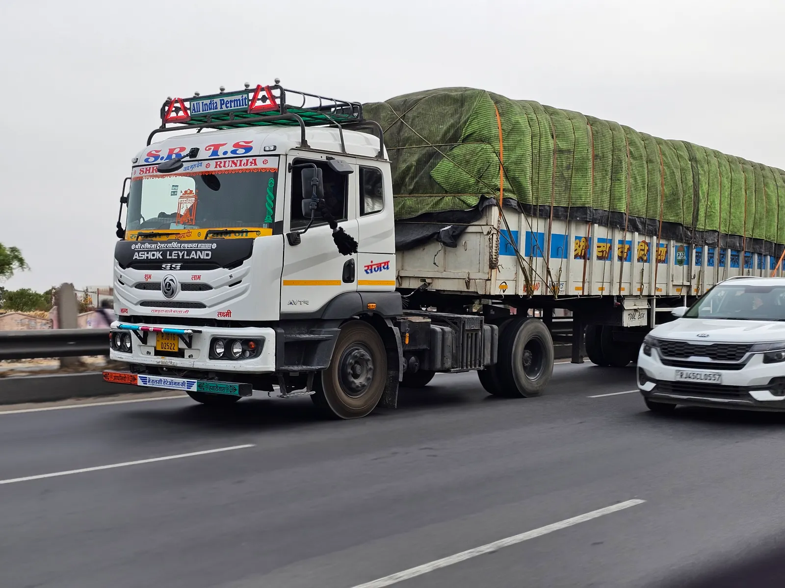 Loaded goods truck travelling on a highway in Rajasthan